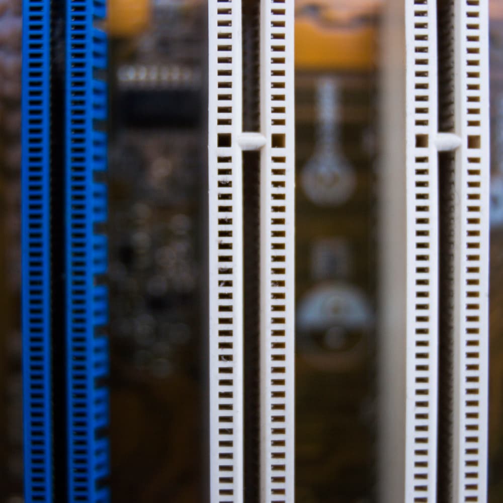 A white and blue computer tower with a yellow label